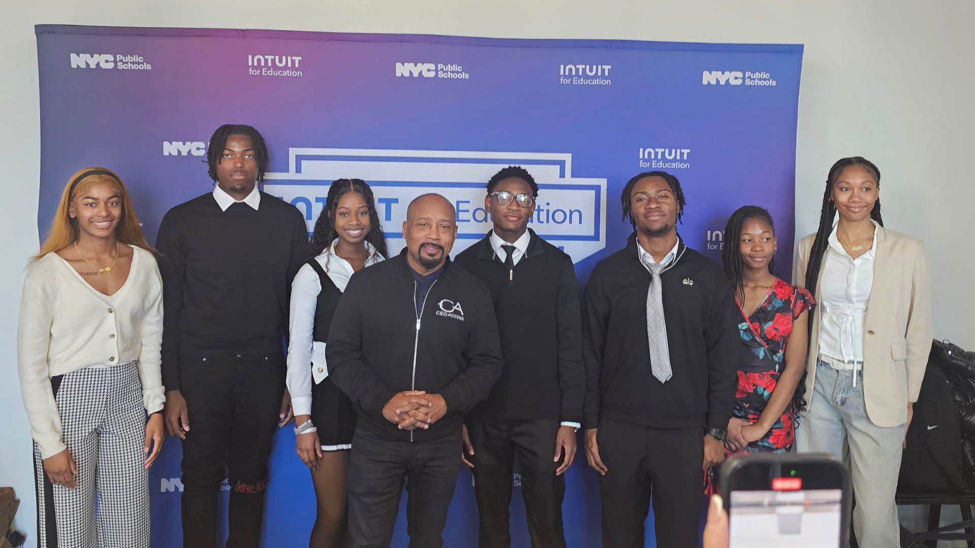 Students with Daymond John from Shark Tank
